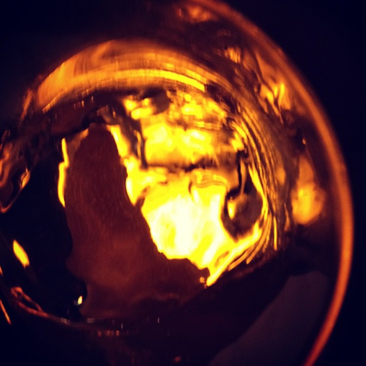 Amber light swirling in glass