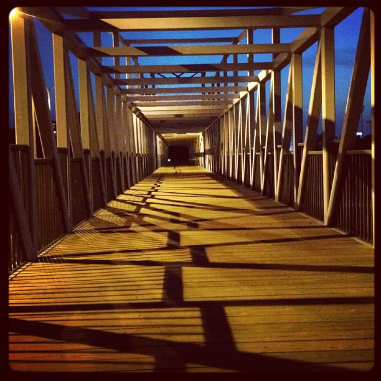 Footbridge shadows at dusk