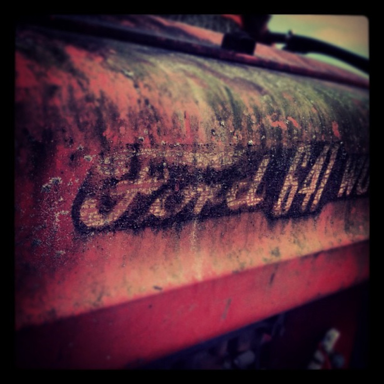Weathered Ford script on a tractor