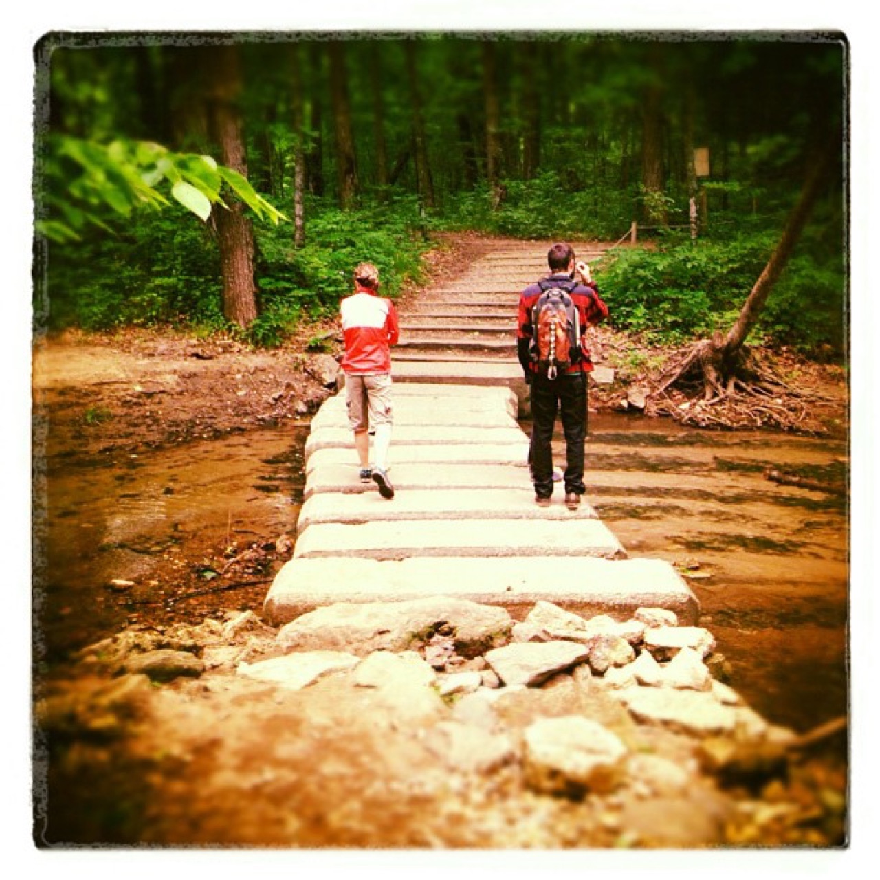 Crossing the stone footbridge