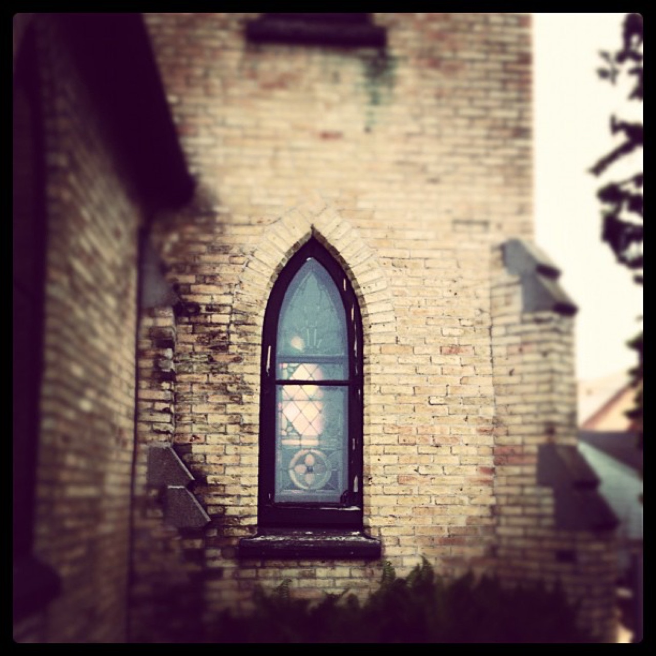 Pointed window in pale brick