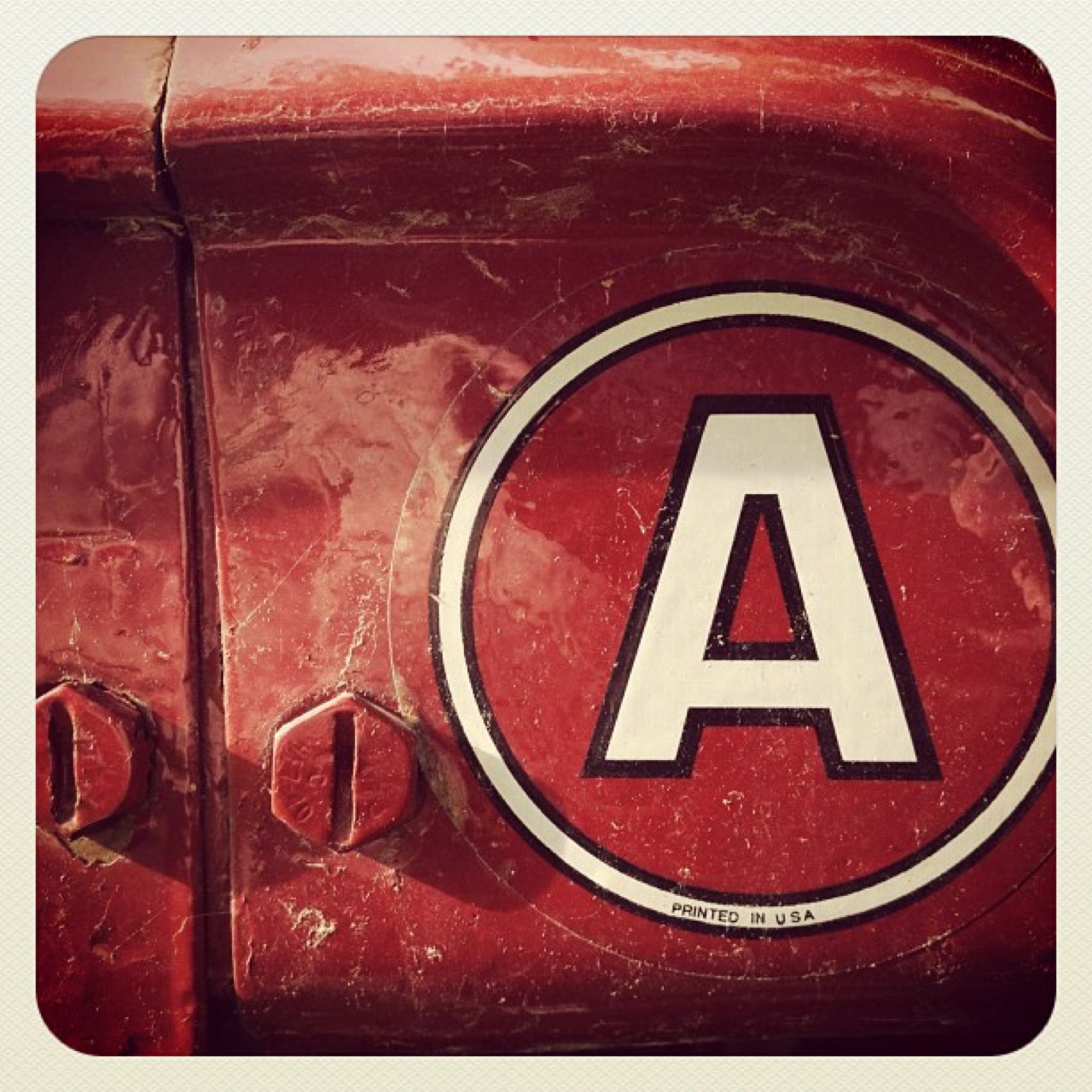 Letter A decal on red steel