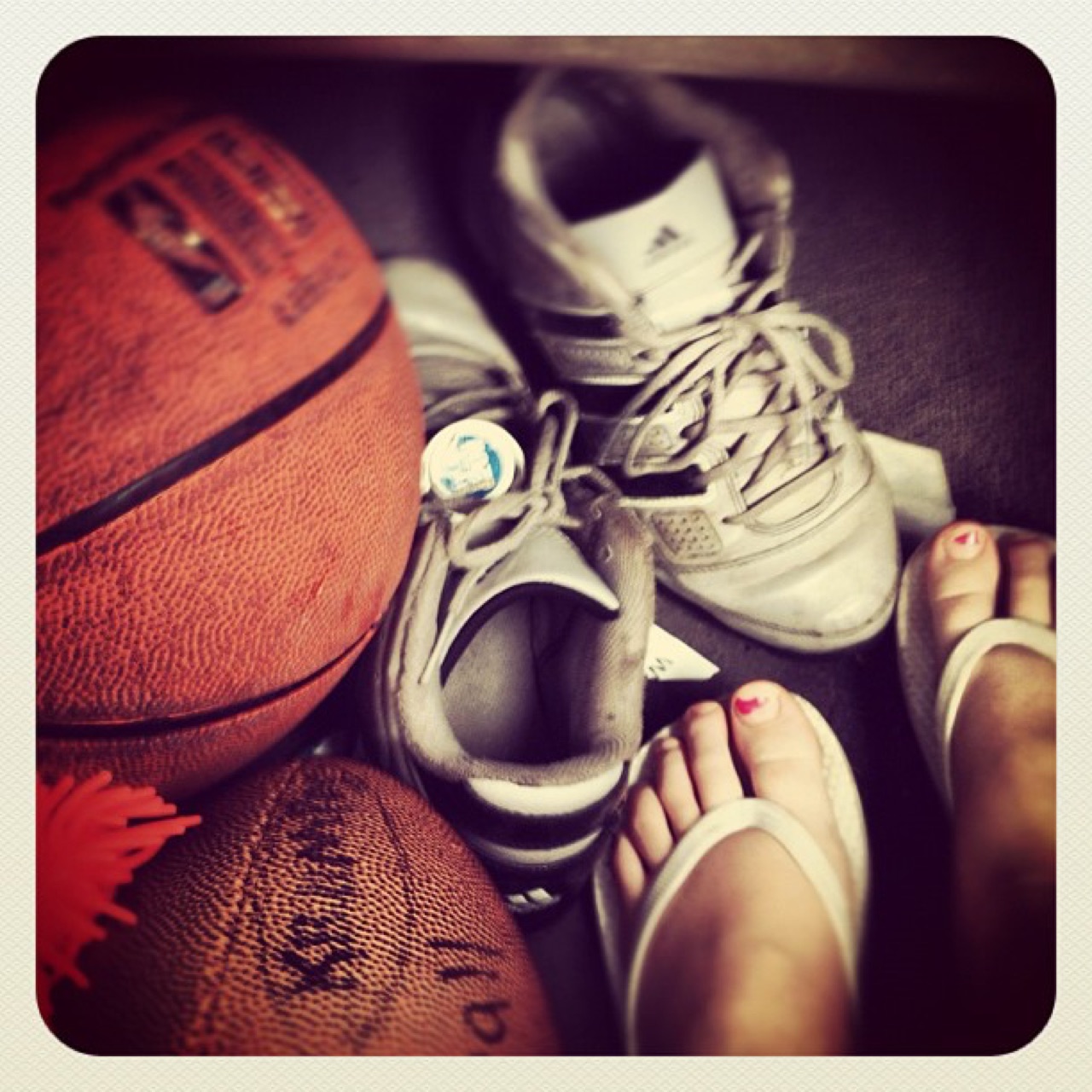 Basketballs, sneakers, and bare feet