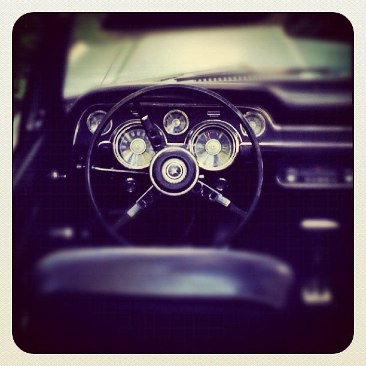 Behind the wheel of a vintage car