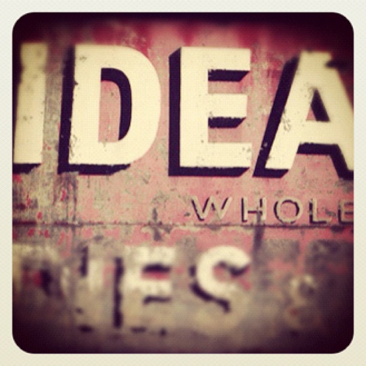 Weathered lettering on an old sign