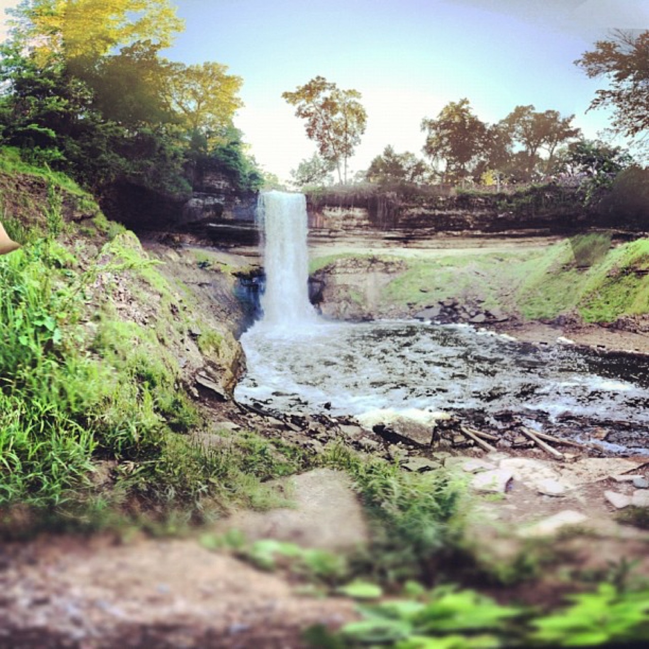 Minnehaha Falls pouring into the green gorge