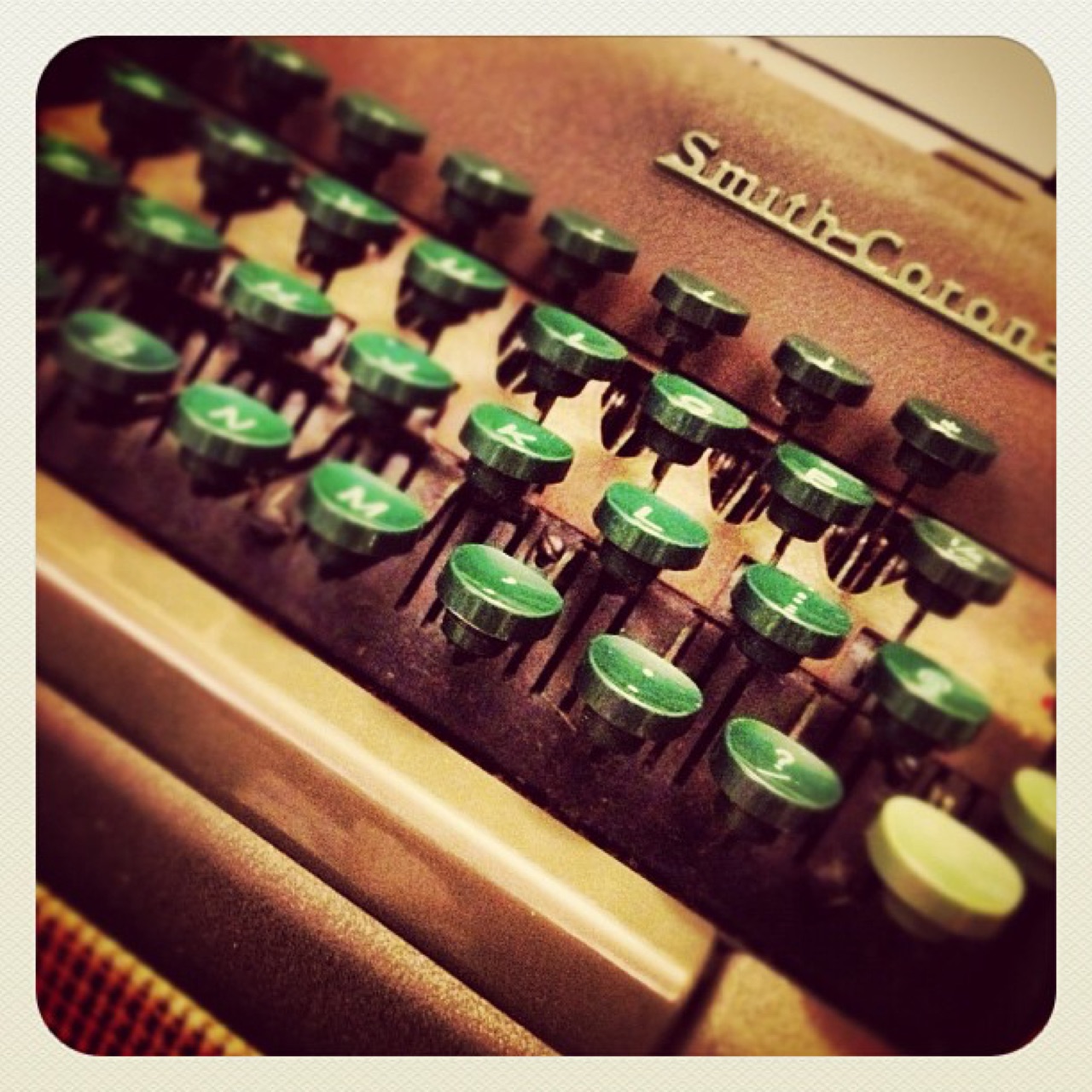 Green keys of a Smith-Corona typewriter