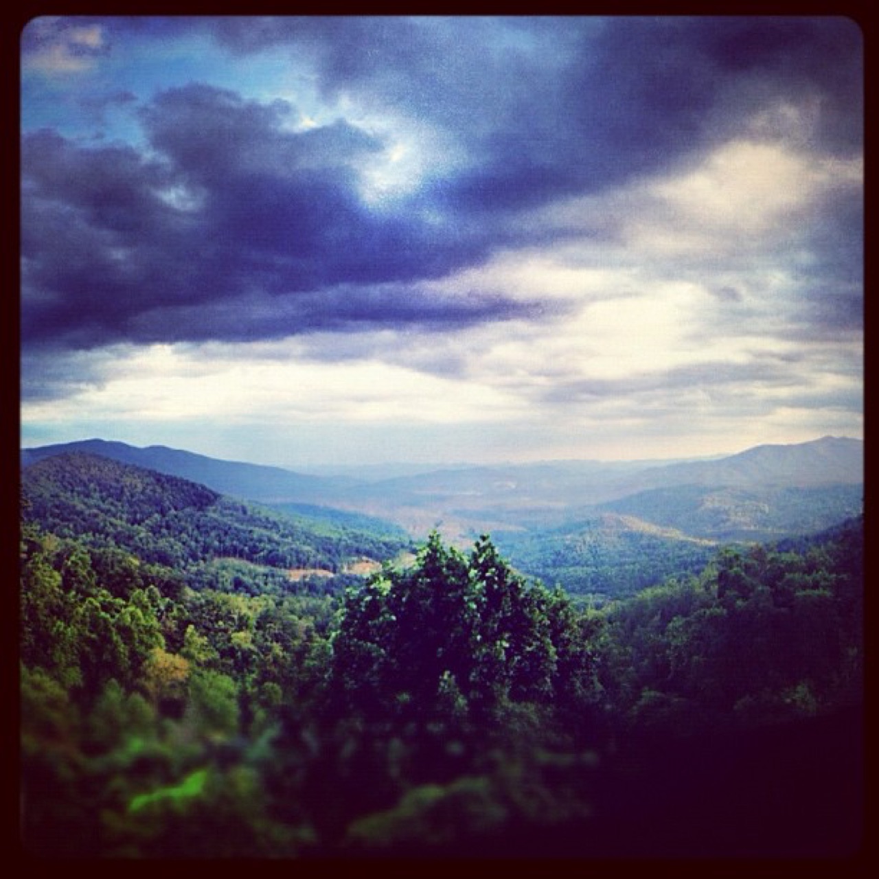 Storm clouds over a mountain valley