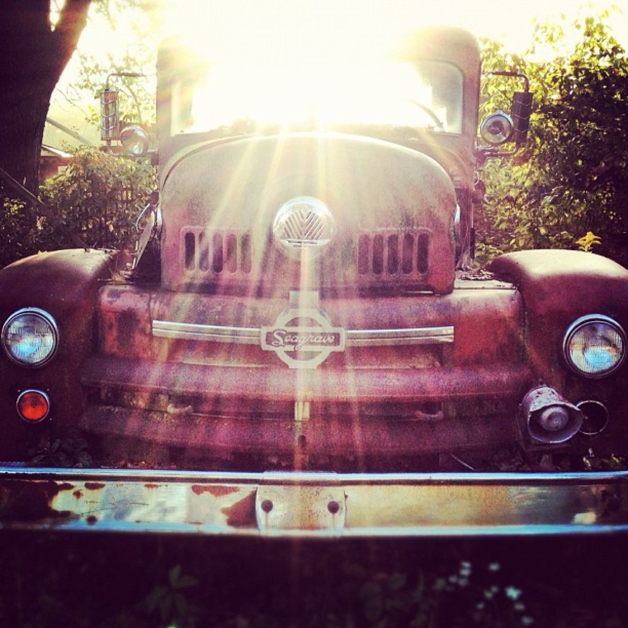 Rusted Seagrave fire truck in the sun