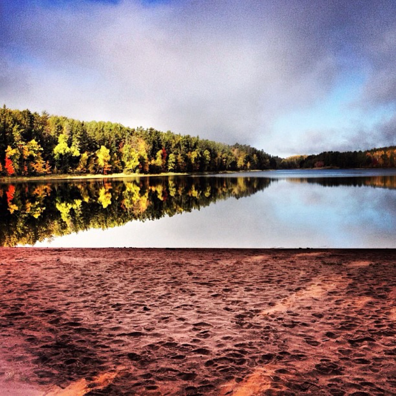 Fall colors mirrored on a quiet lake