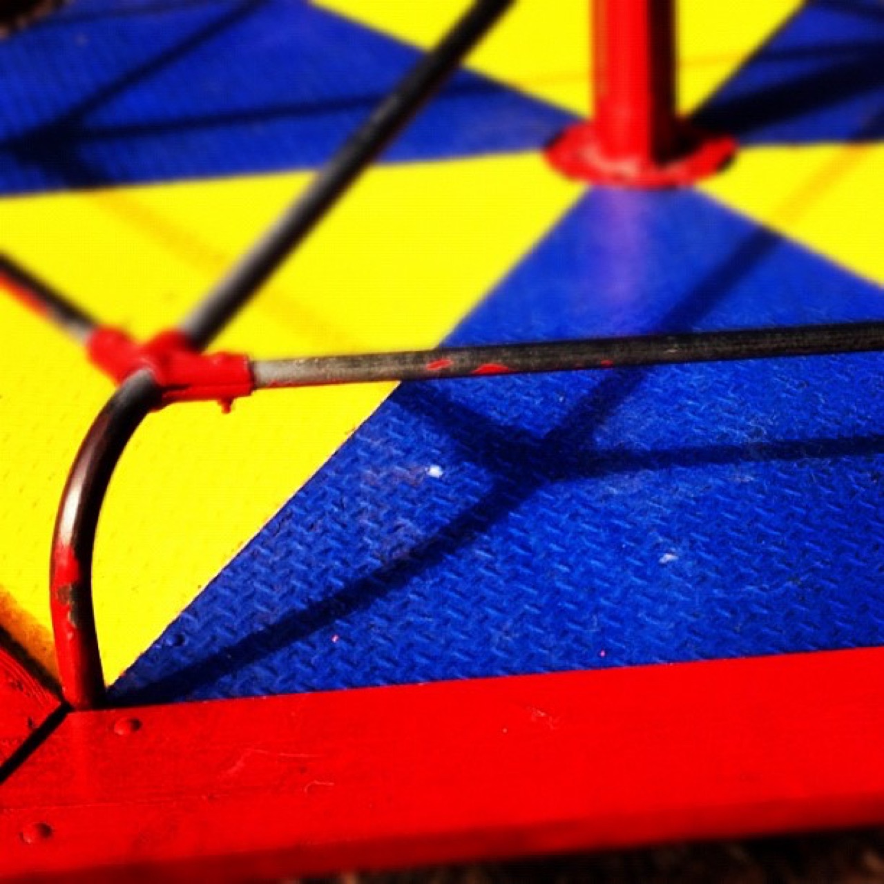 Primary colors on old playground steel