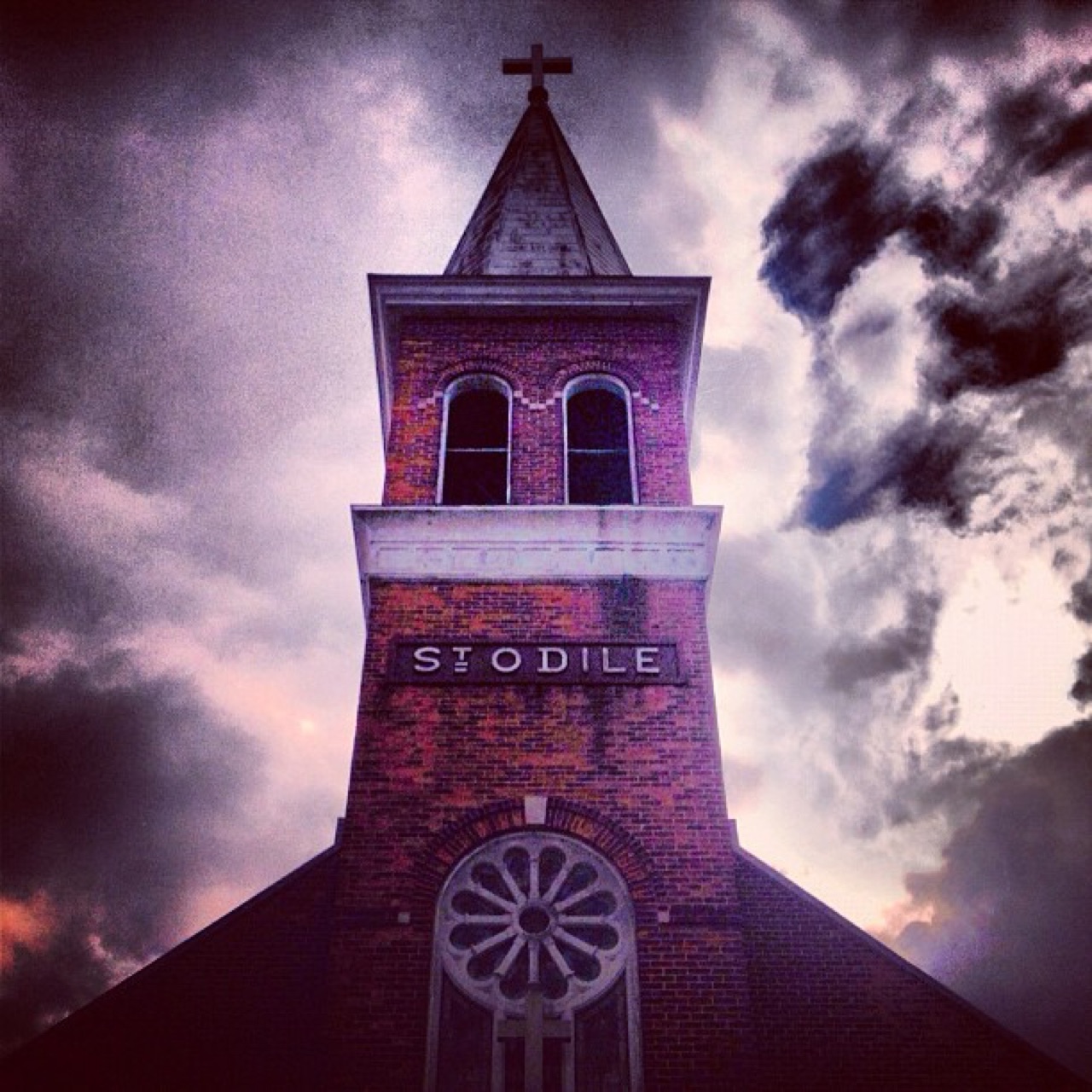 St. Odile's tower against storm clouds
