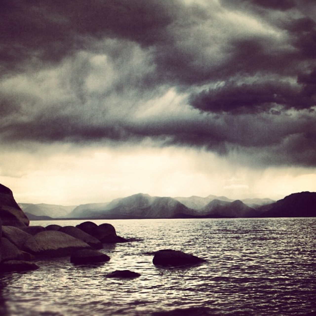 Storm sweeping a mountain lake