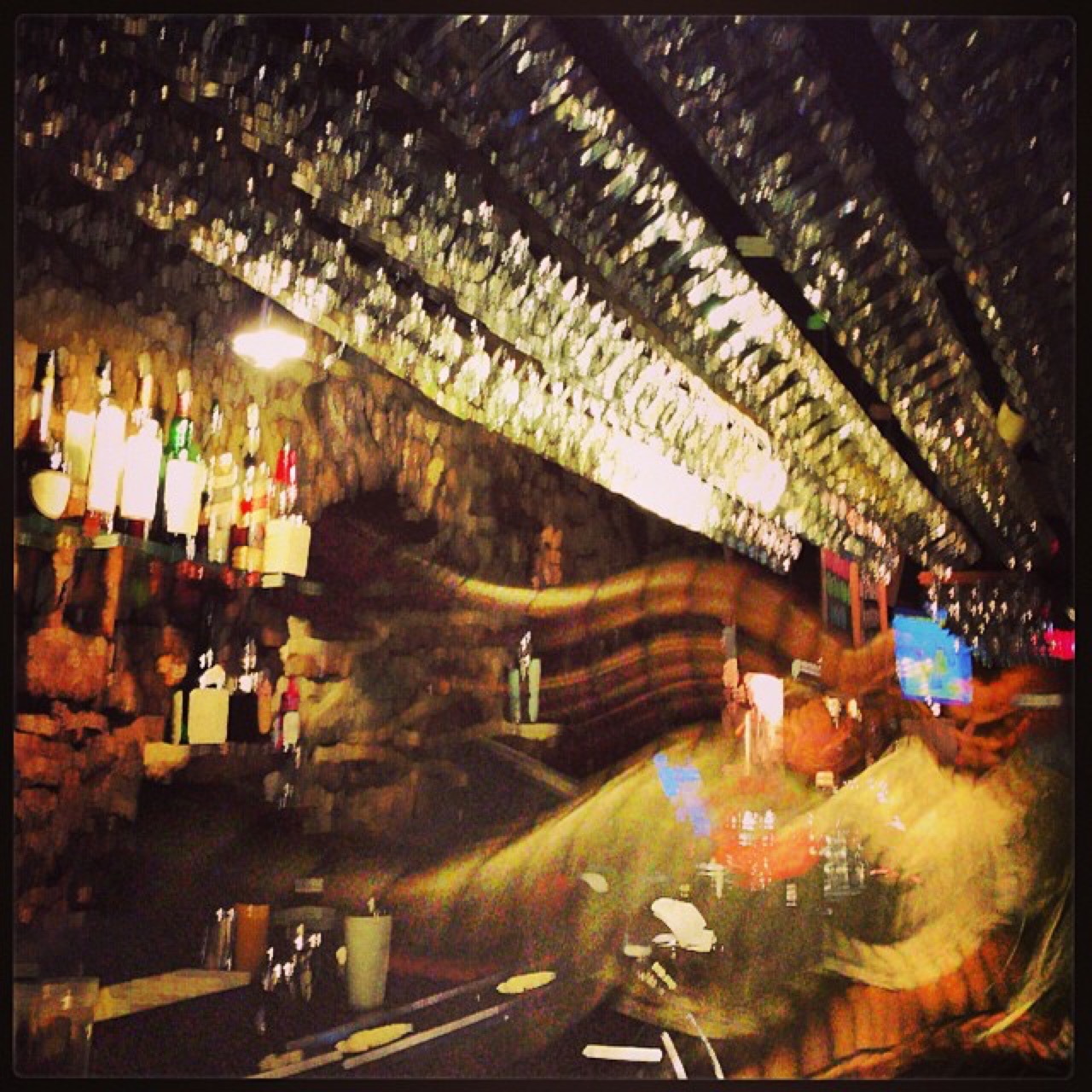 Blurred evening in a stone-walled tavern