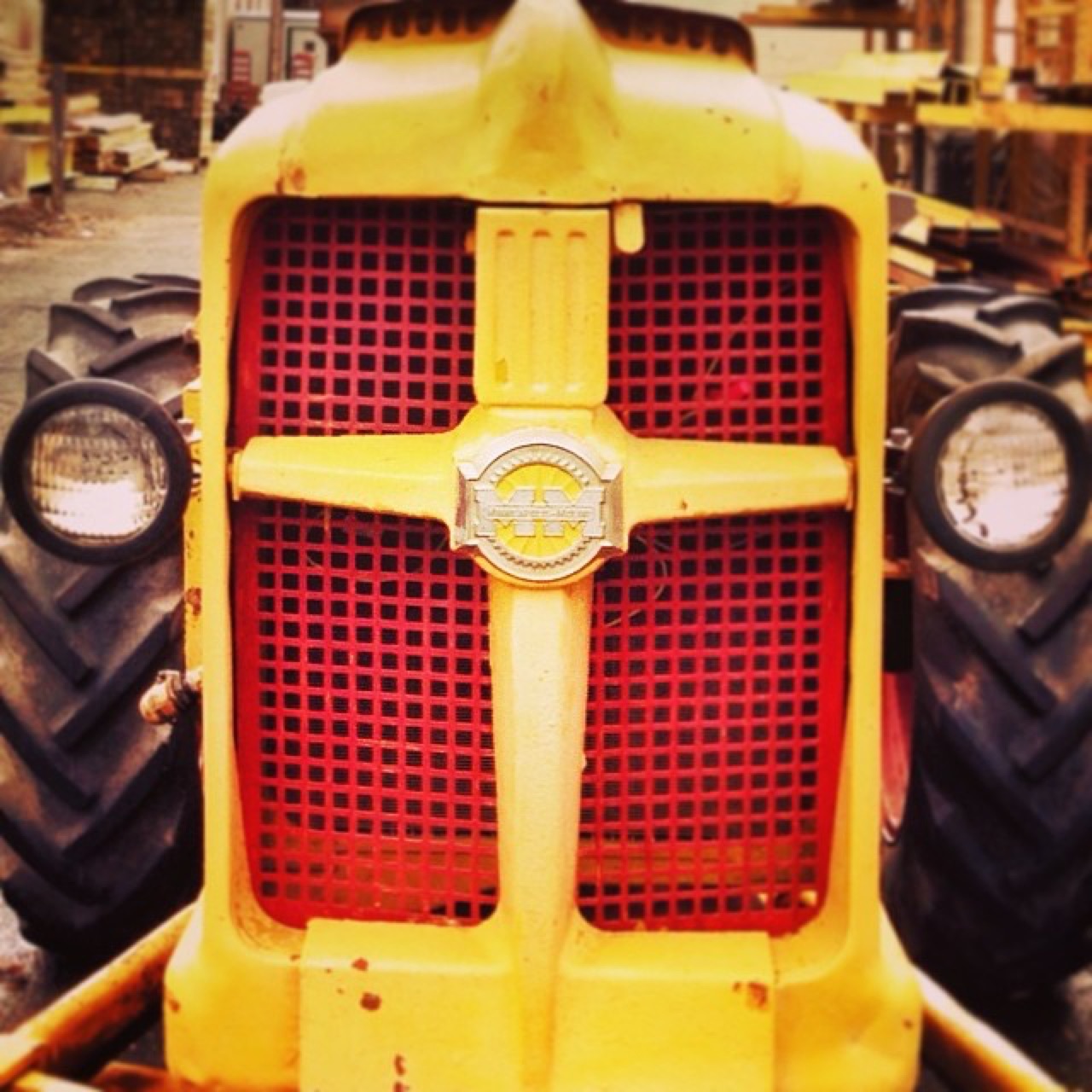 Yellow tractor grille with MM badge