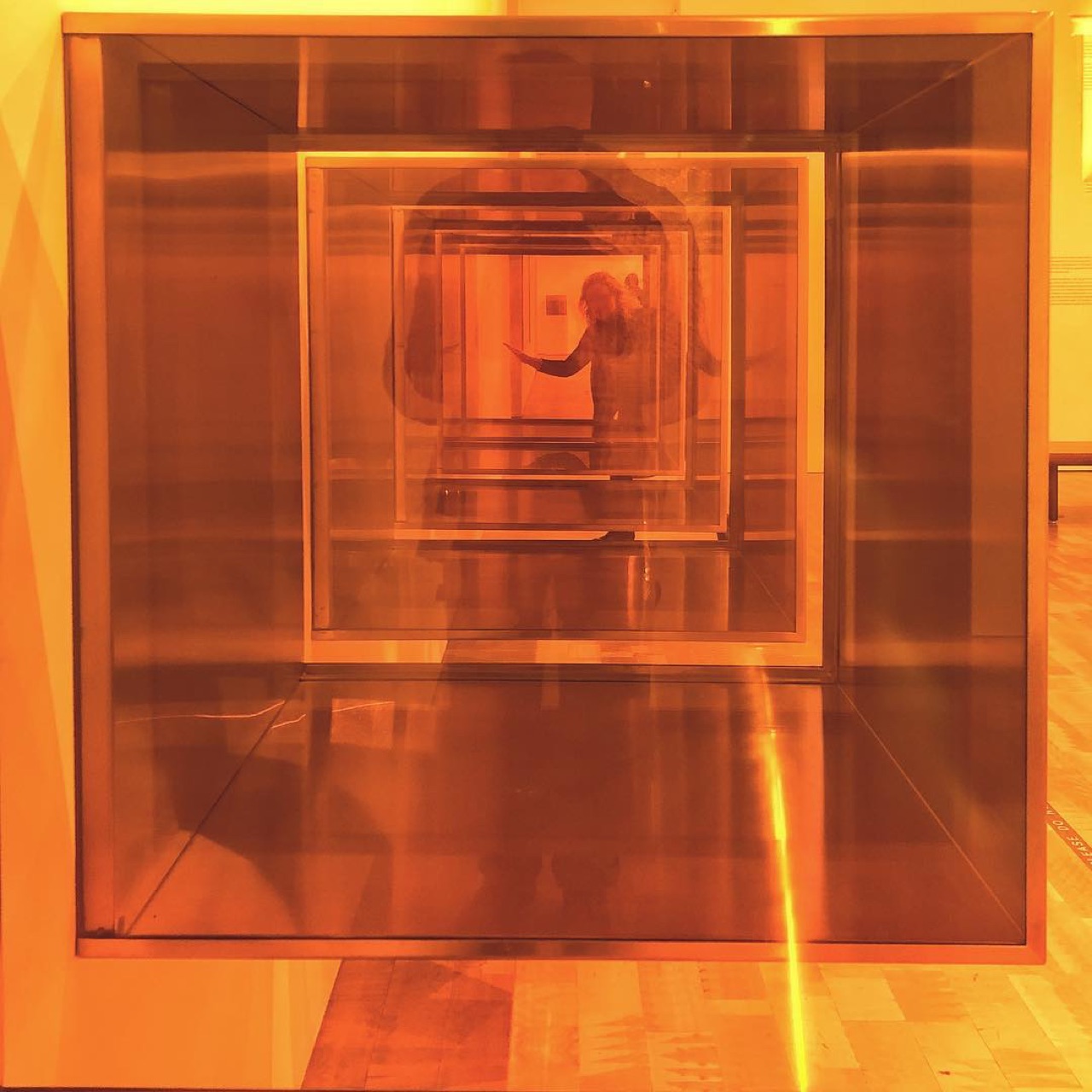 Nested glass cubes in amber light