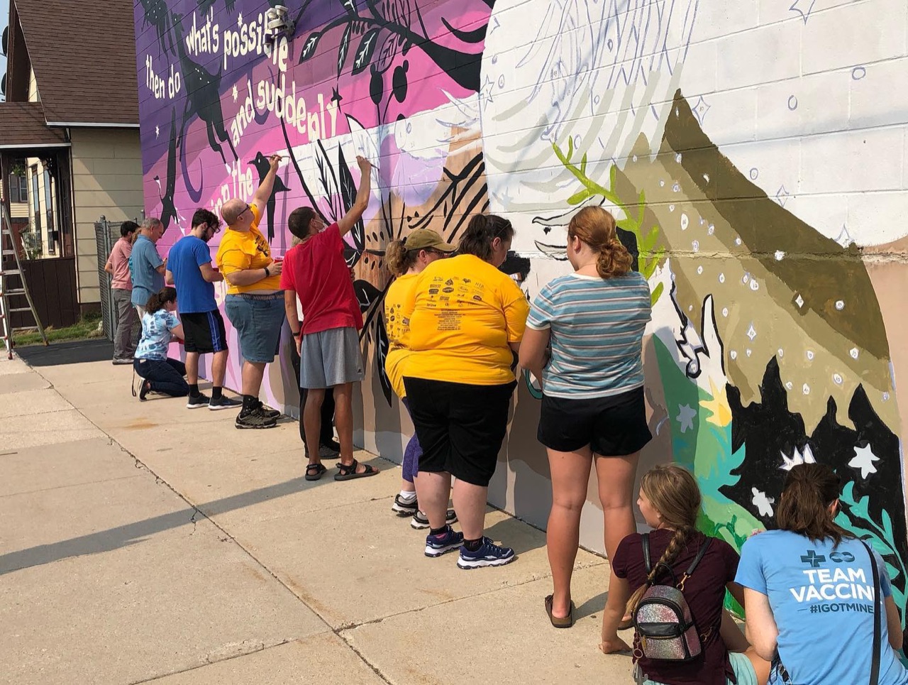 The community residents of Manitowoc showed up to paint a mural…