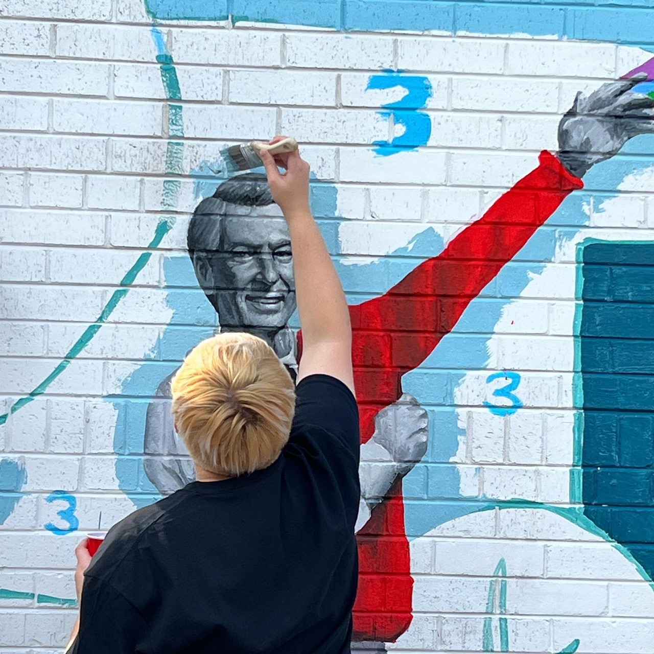 It was beautiful day in the neighborhood as we completed this mural…