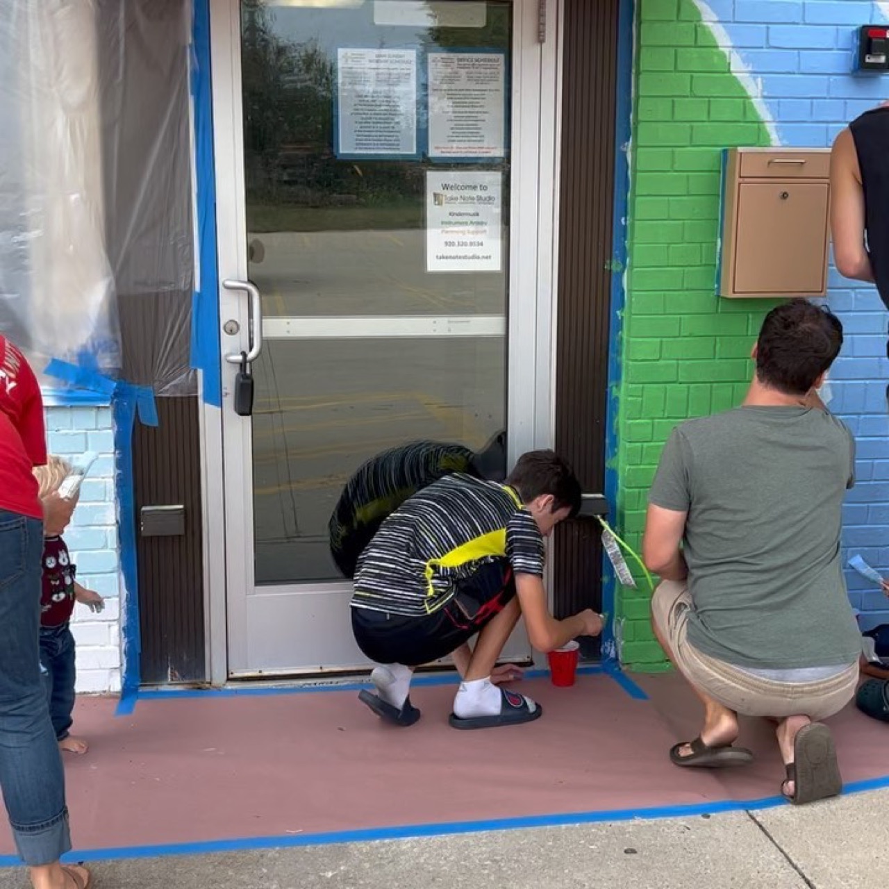 It was beautiful day in the neighborhood as we completed this mural…