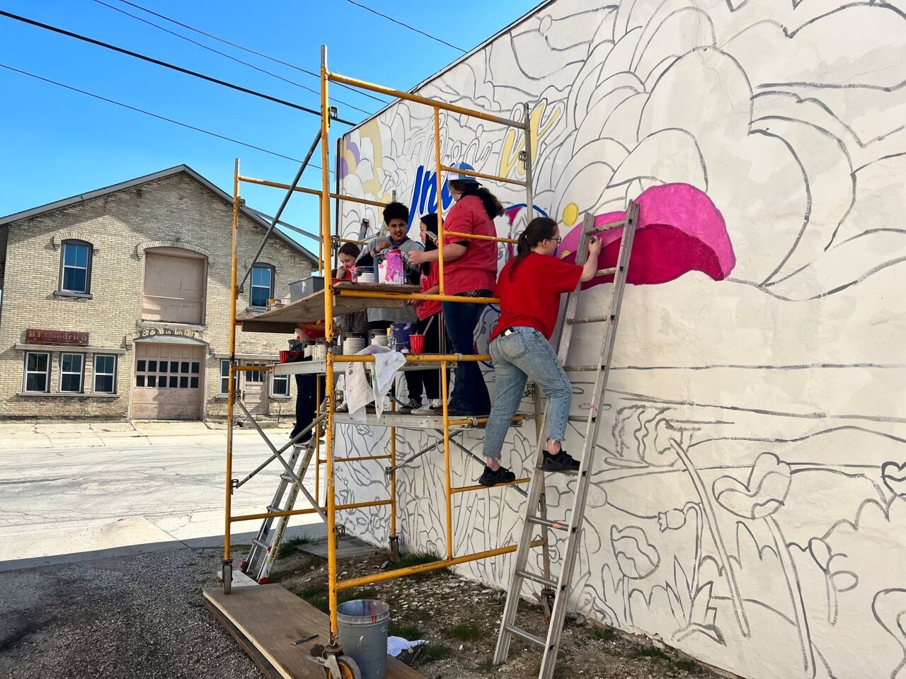 We can see our latest mural from our backyard!