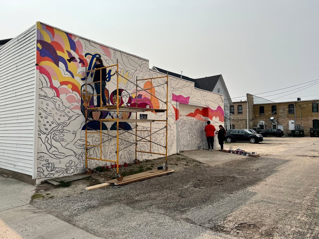 We can see our latest mural from our backyard!