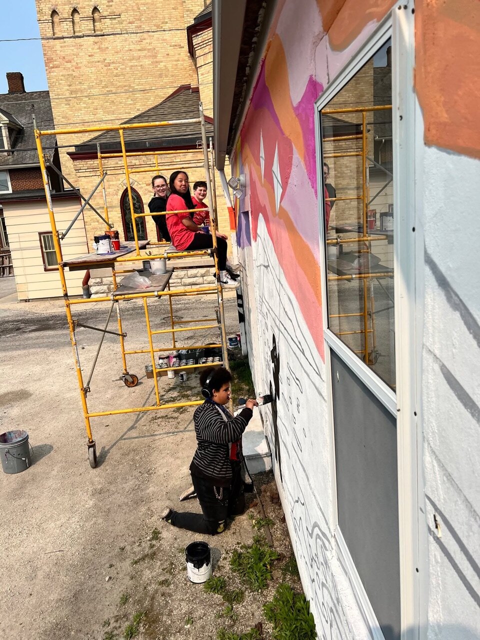 We can see our latest mural from our backyard!