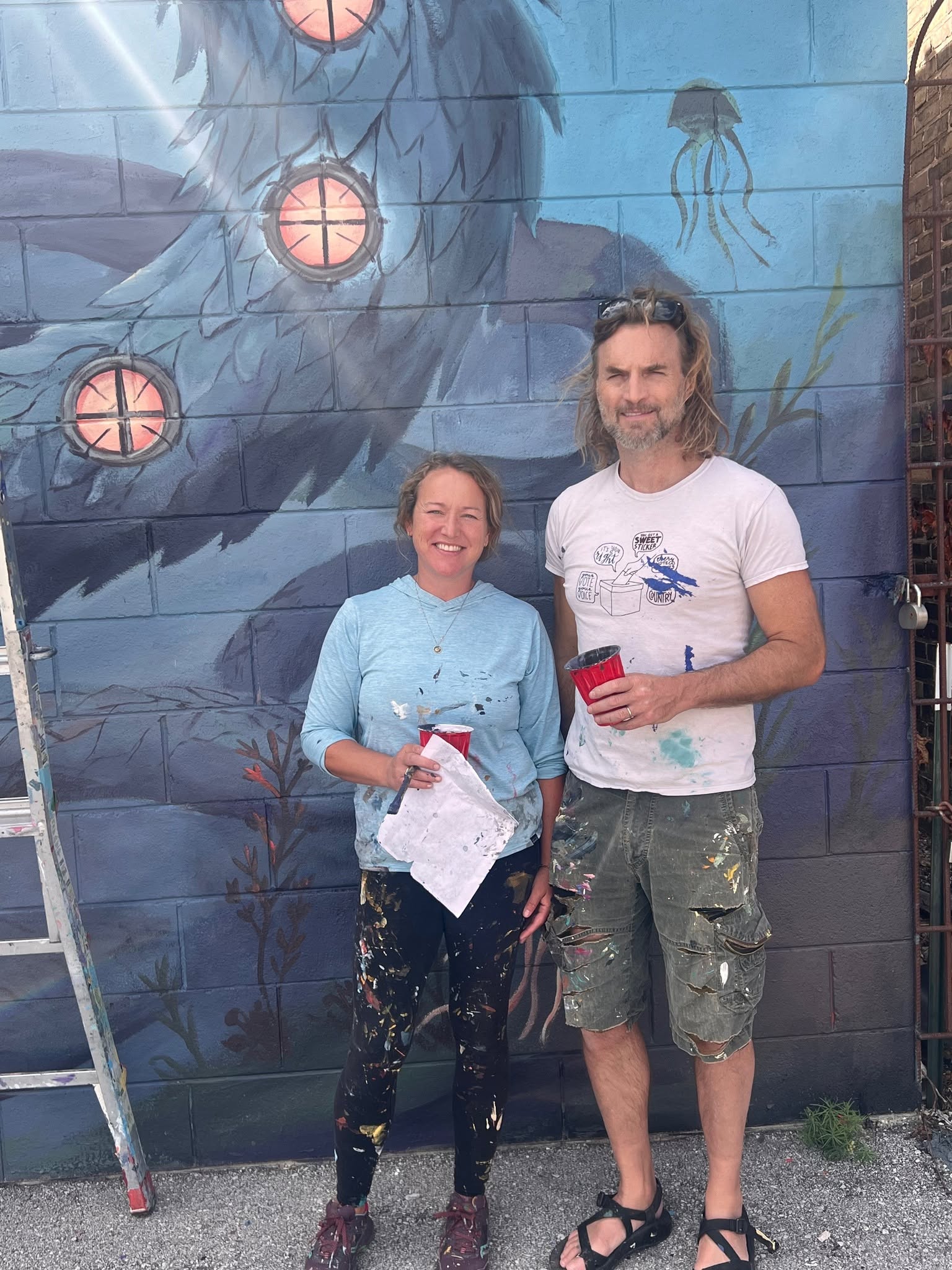 Don Krumpos and Erin La Bonte at the finished wall.