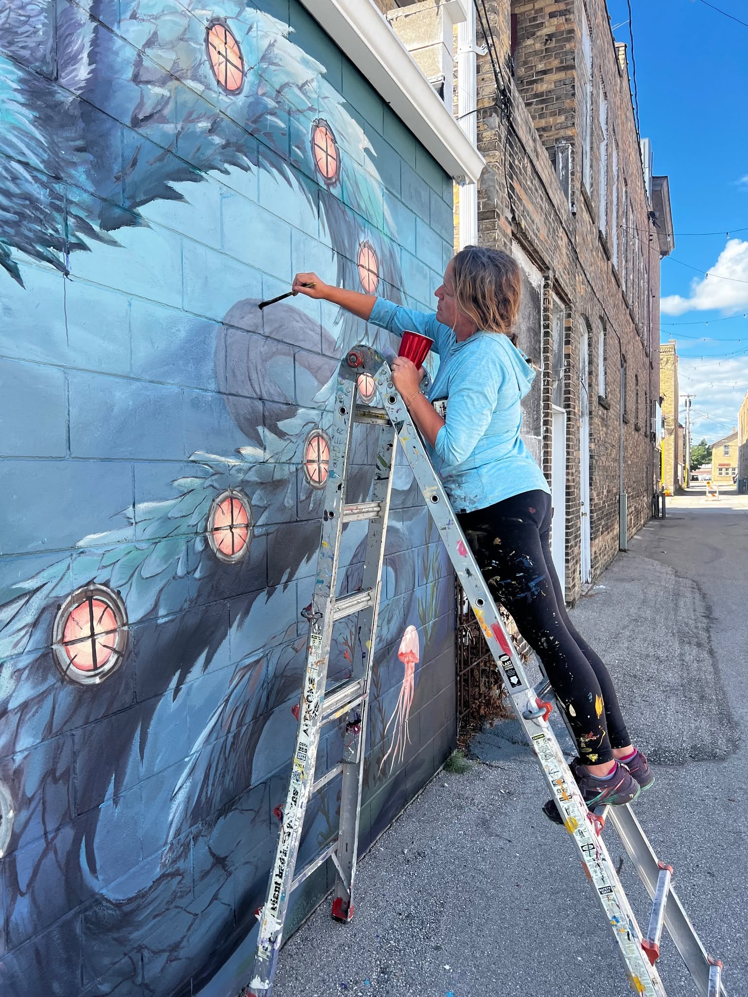 Painting the porthole lights along the creature's flank.