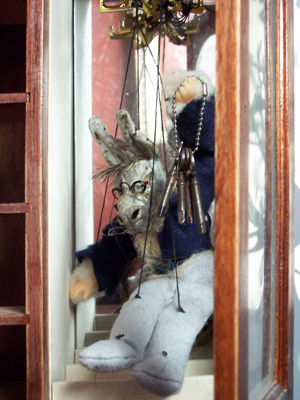 The donkey puppet, a cluster of skeleton keys at its throat. The most alive thing I made.